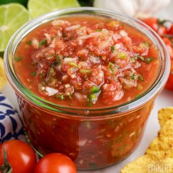 Restaurant style salsa in a glass jar.