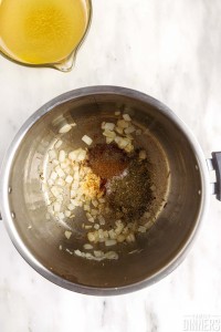 Onion and spices in instant pot.