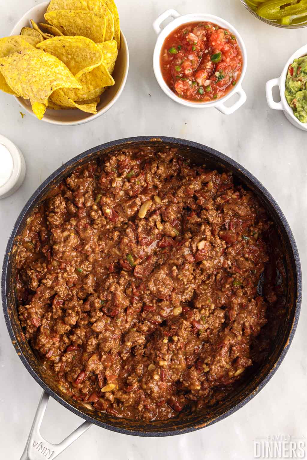 Mixed ground beef and beans in a skillet.