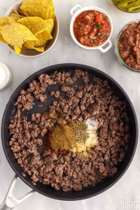 Pan of cooked ground beef and other ingredients.