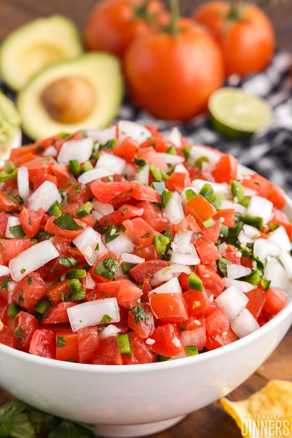 close up of pico de gallo in a white bowl
