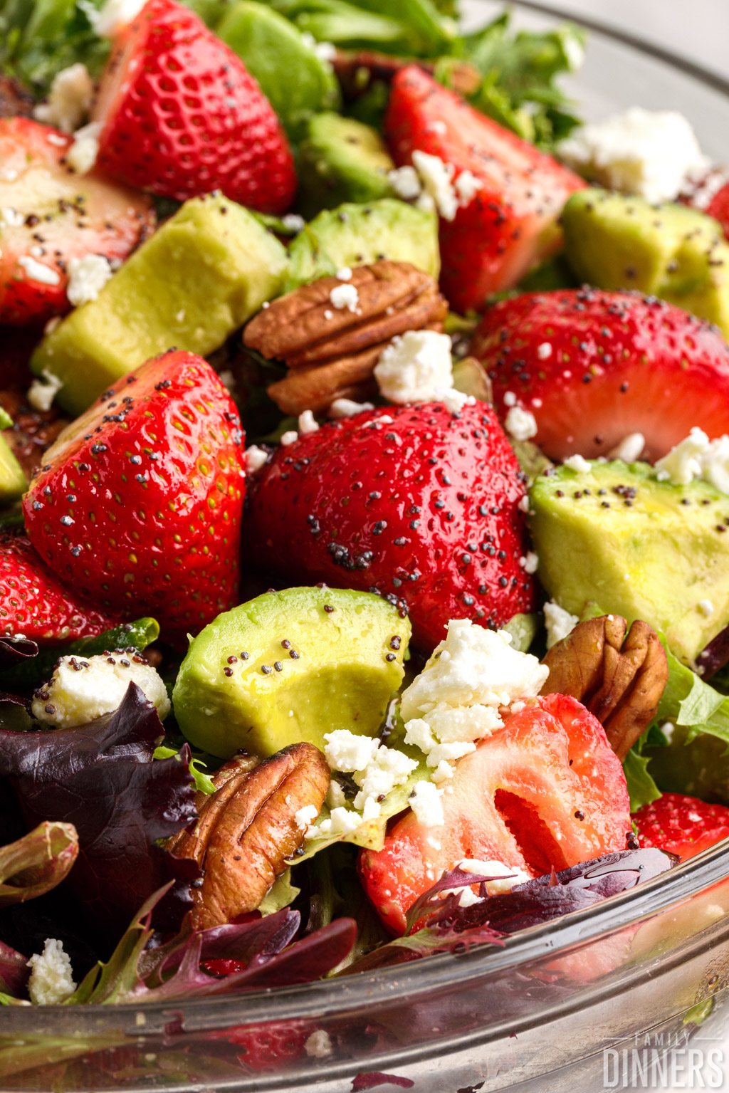 close up of strawberries and avocados in the salad