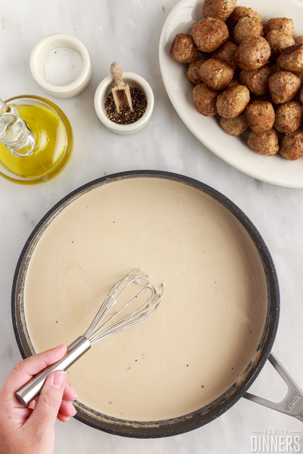 Swedish meatball sauce in a skillet.