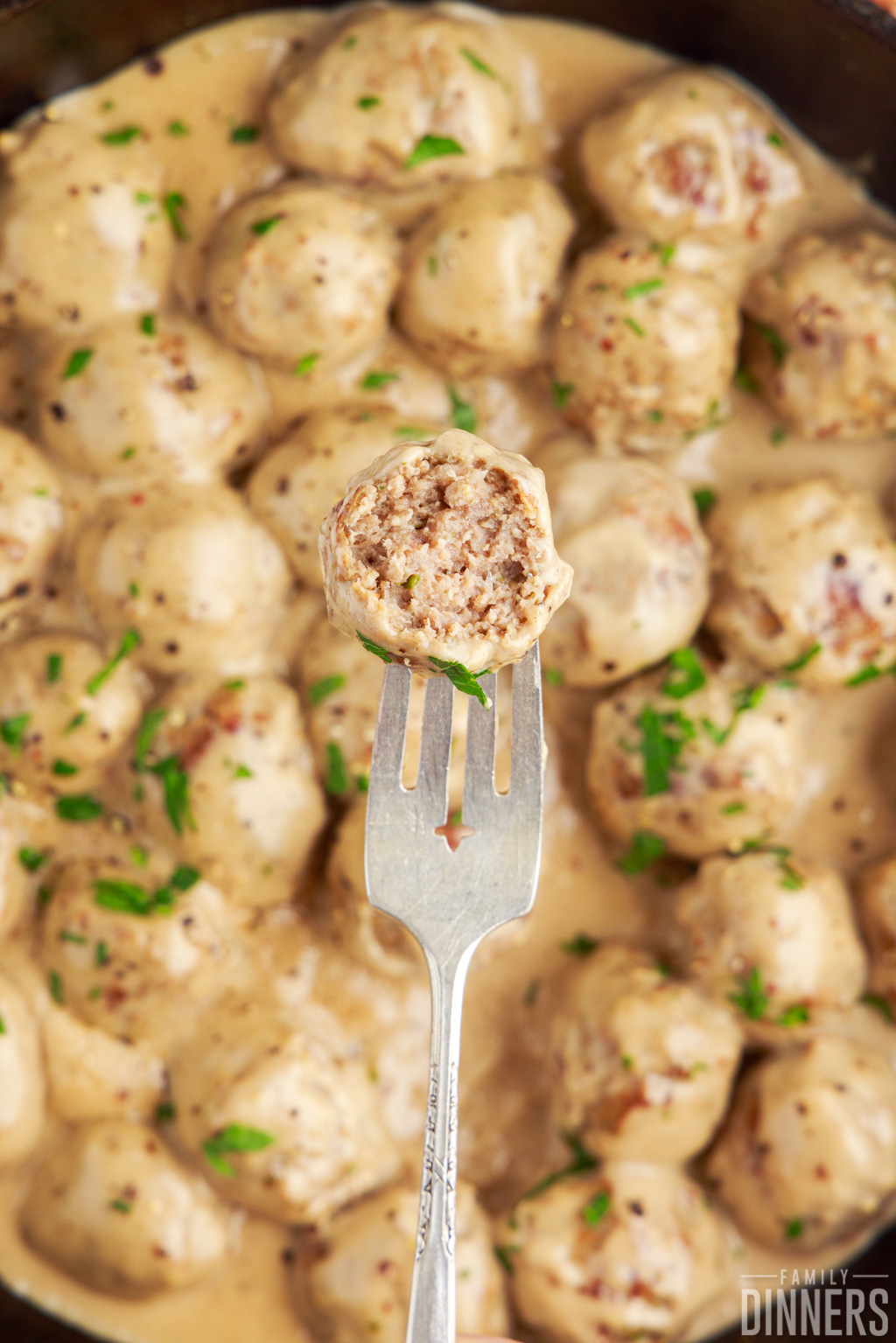 meatball on a fork with a bite taken out