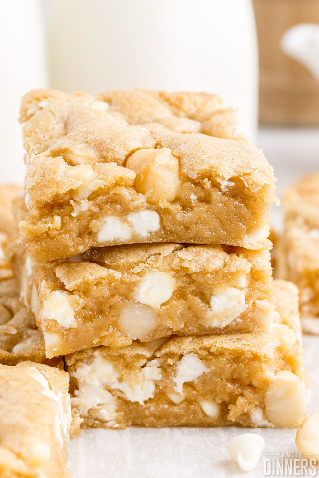 close up of stacked macadamia white chocolate cookie bars