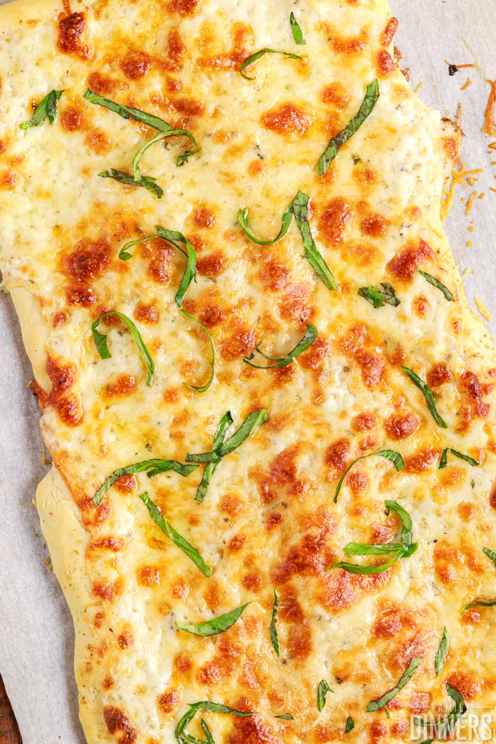 Cooked white cheese pizza.
