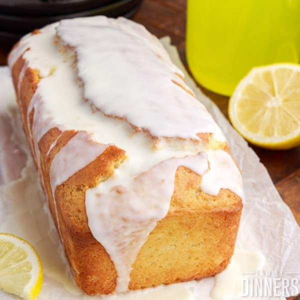 loaf of limoncello cake with white limoncello glaze.
