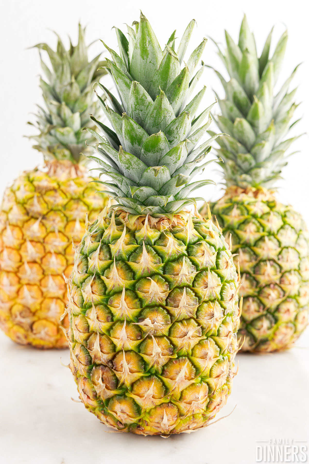 3 ripe pineapples.