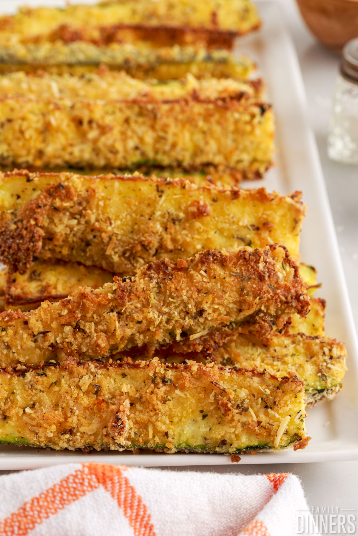 Stack of air fryer zucchini fries.