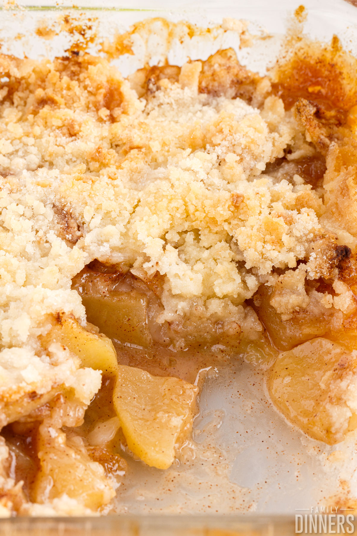 Close up of apple crisp without oats in a baking dish.