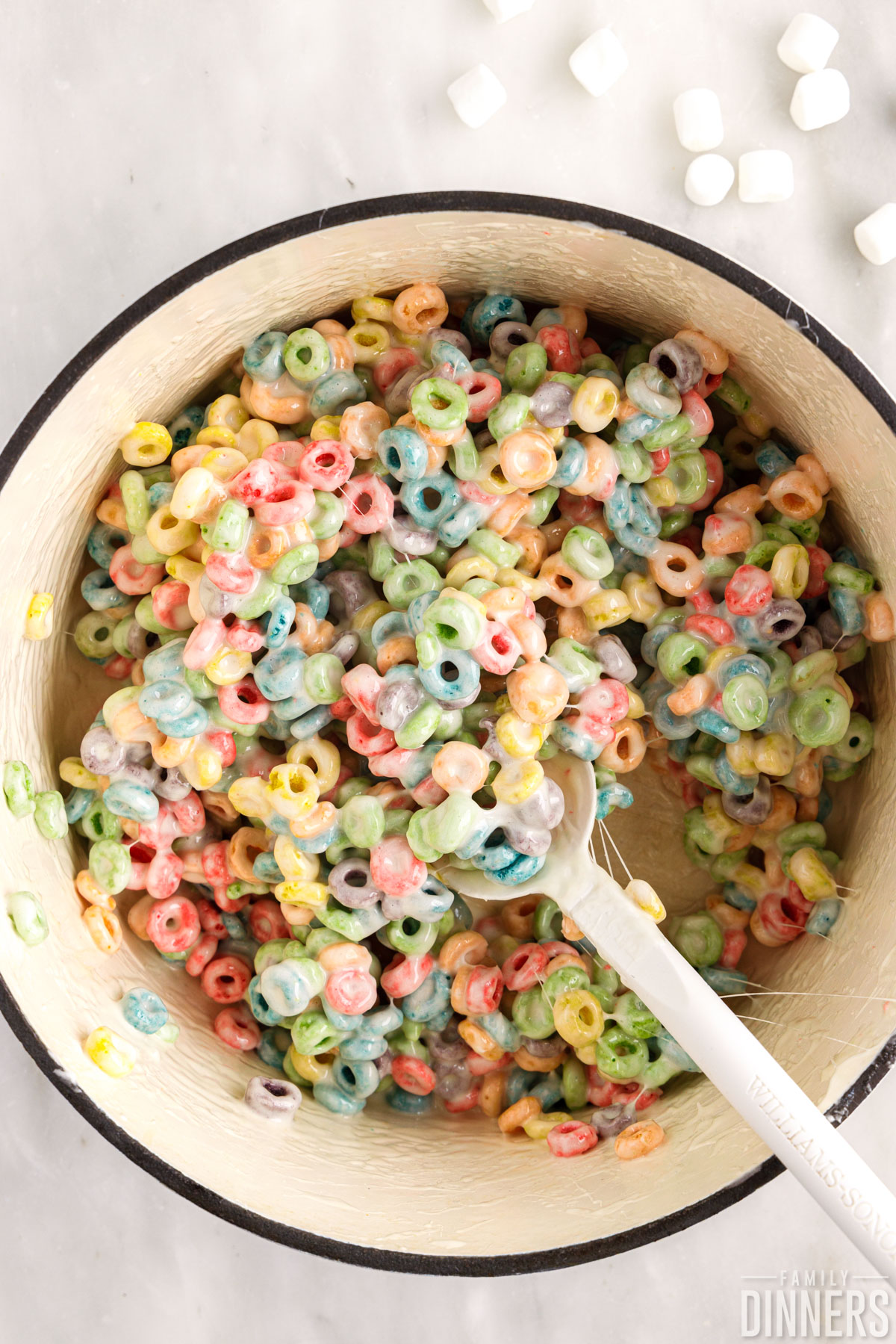 Fruit loops and marshmallows mixed in a pot.