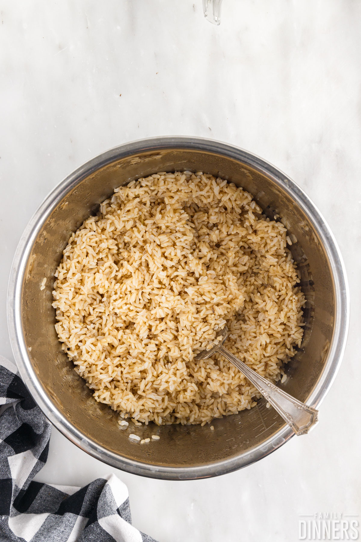 fluffed up rice in the Instant Pot with a fork 