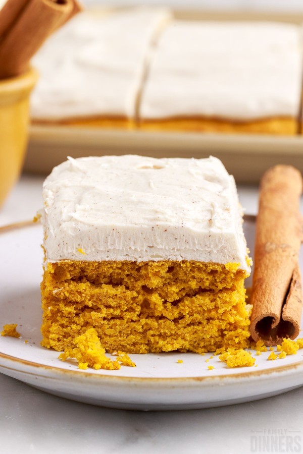 Pumpkin bar with frosting on a plate.