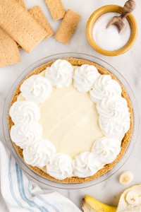 whipped cream piped on top of banana pie
