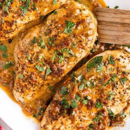 Chicken breasts in a creamy sauce.