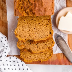 slices of pumpkin bread with butter and a knife