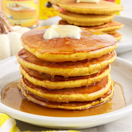 pumpkin pancakes with pancake mix in a pile.