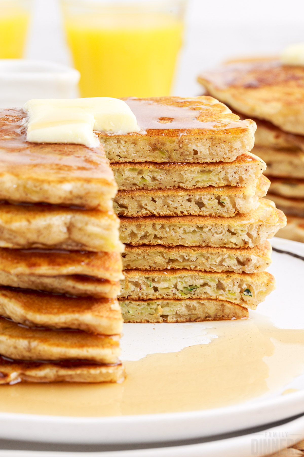 stack of pancakes with a quarter cut out
