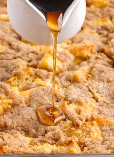 Syrup pouring on overnight french toast casserole.