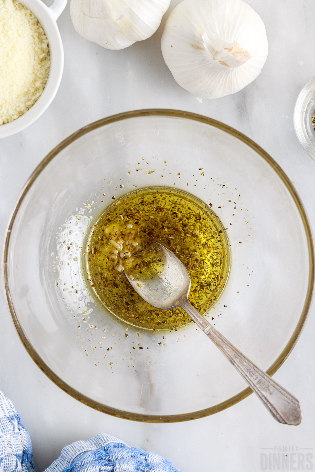 mixing olive oil with spices and garlic