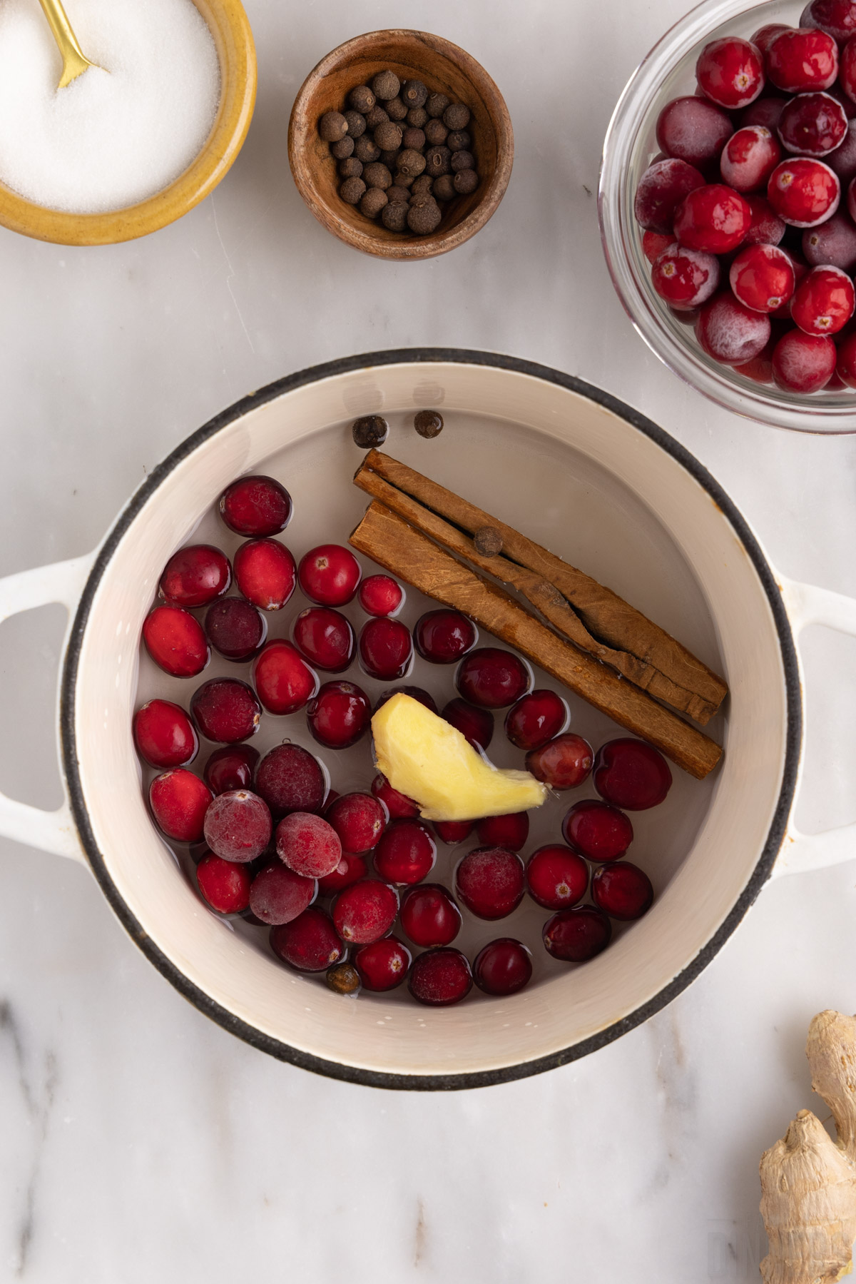 cranberry simple syrup ingredients in a saucepan