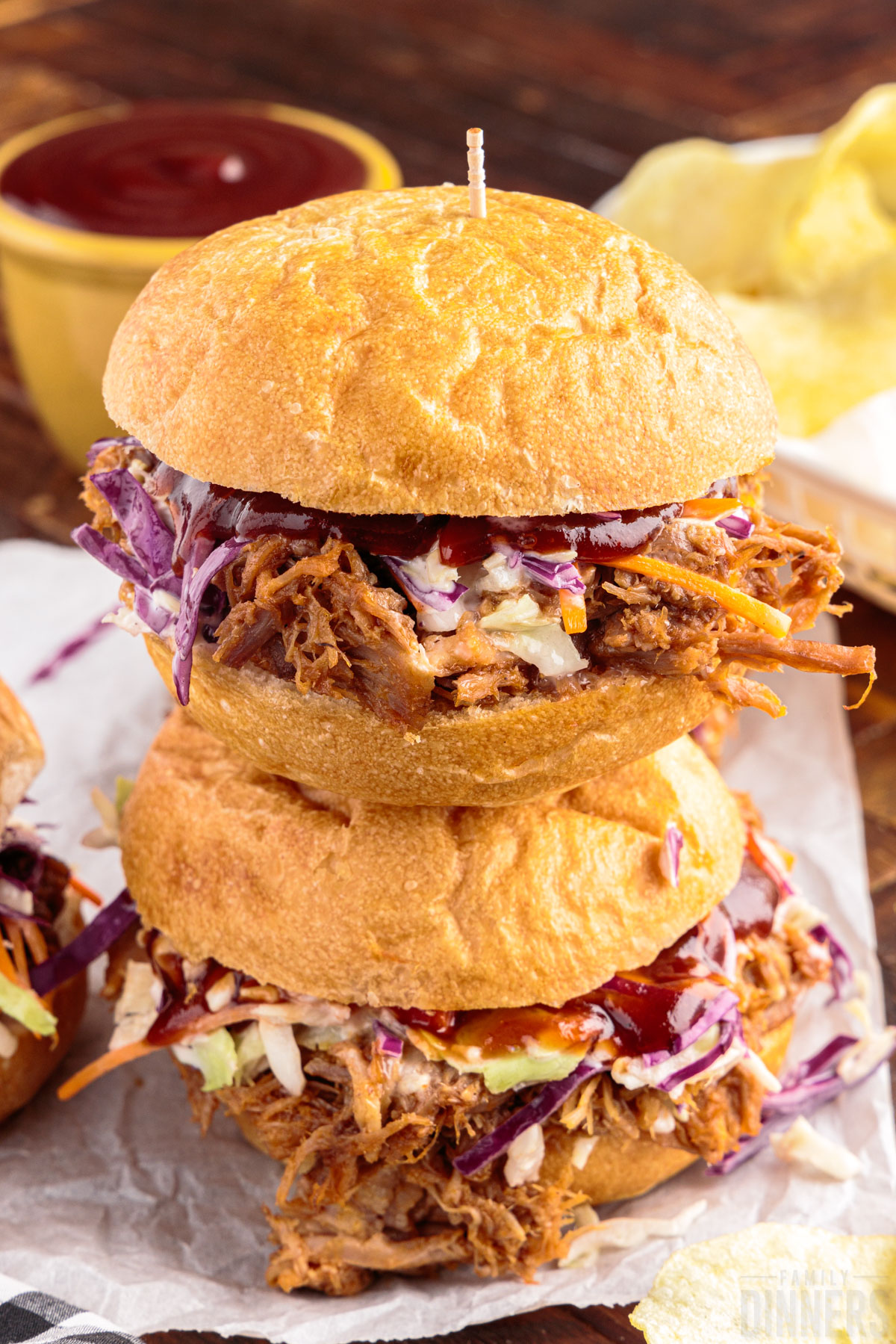 two instant pot pork sliders stacked on top of each other 