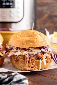 bbq pulled pork slider in front of an instant pot