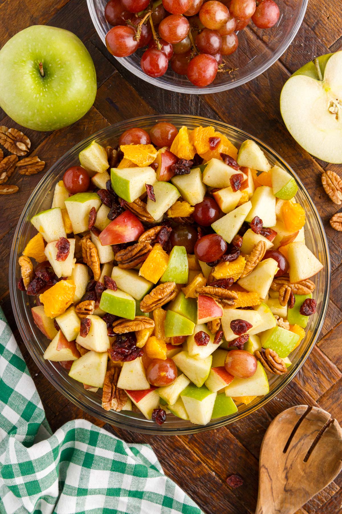 bowl of thanksgiving fruit salad with a wooden spoon 