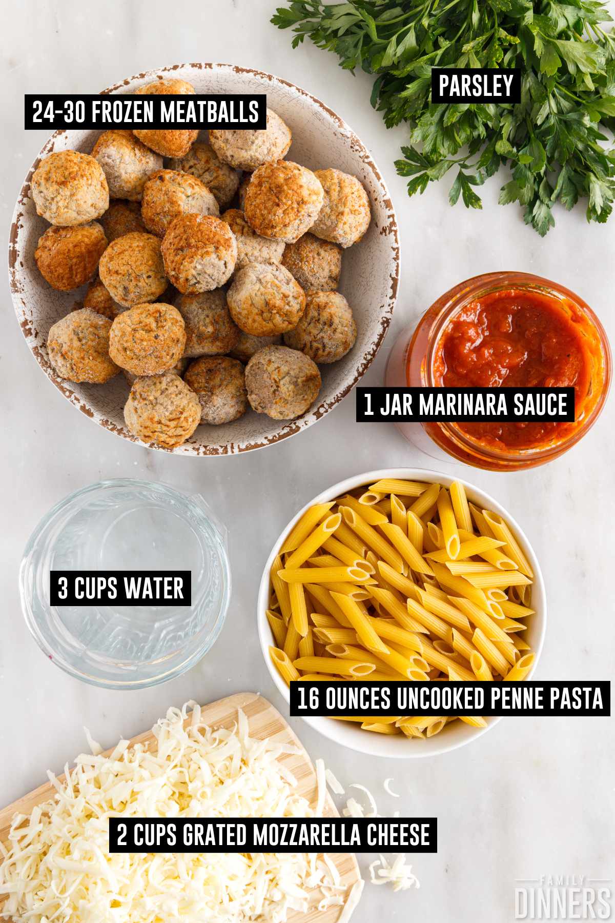 Dump and bake meatball casserole ingredients labeled in containers including: 24-30 frozen meatballs, 1 jar marinara sauce, 3 cups water, 16 ounces dry penne pasta, 2 cups shredded mozzarella.