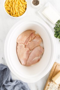 raw chicken breasts in the slow cooker