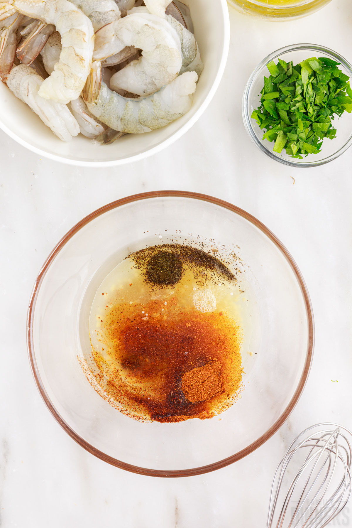 shrimp marinade ingredients in a glass bowl