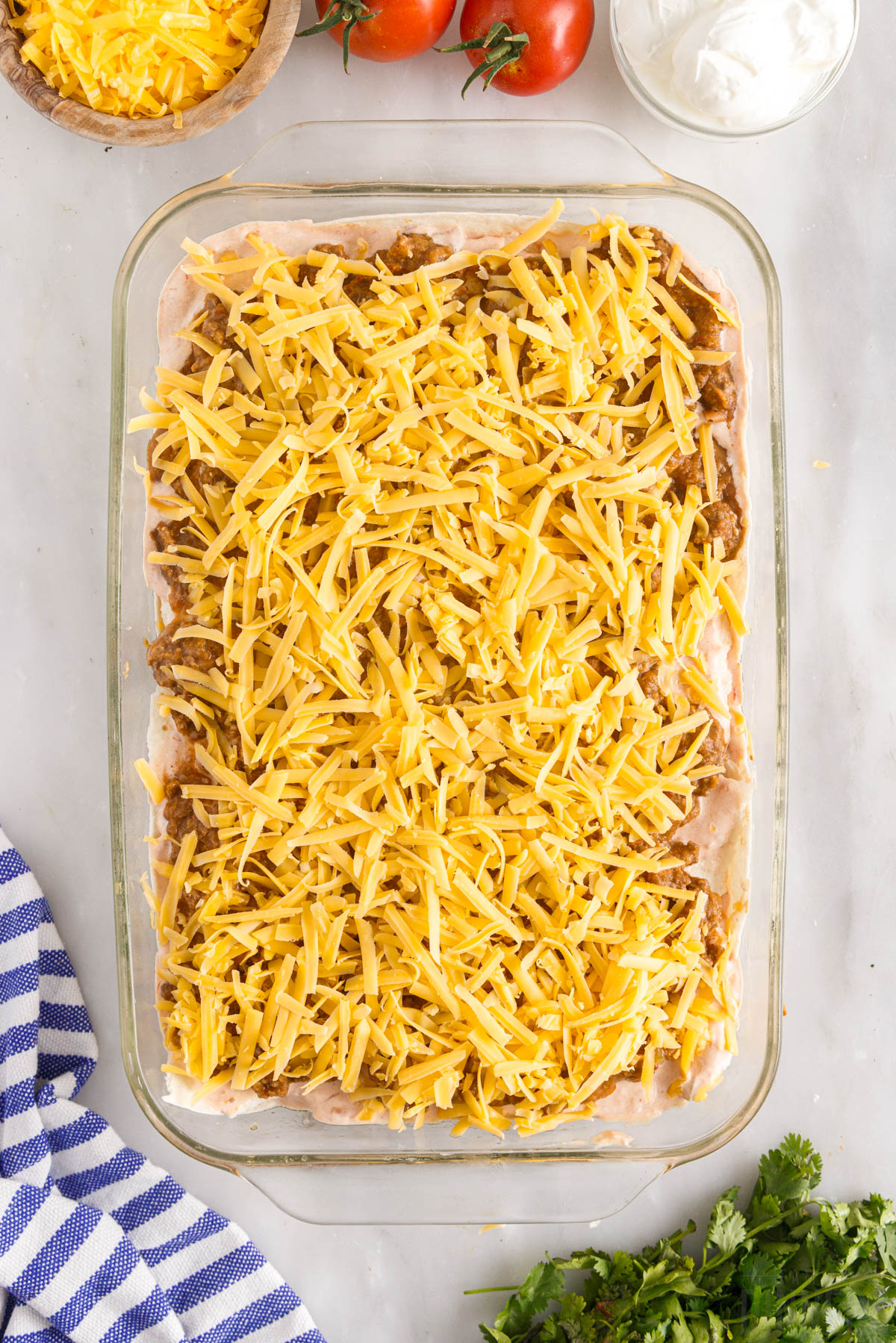 final layer of cheese on Mexican taco casserole with ground beef