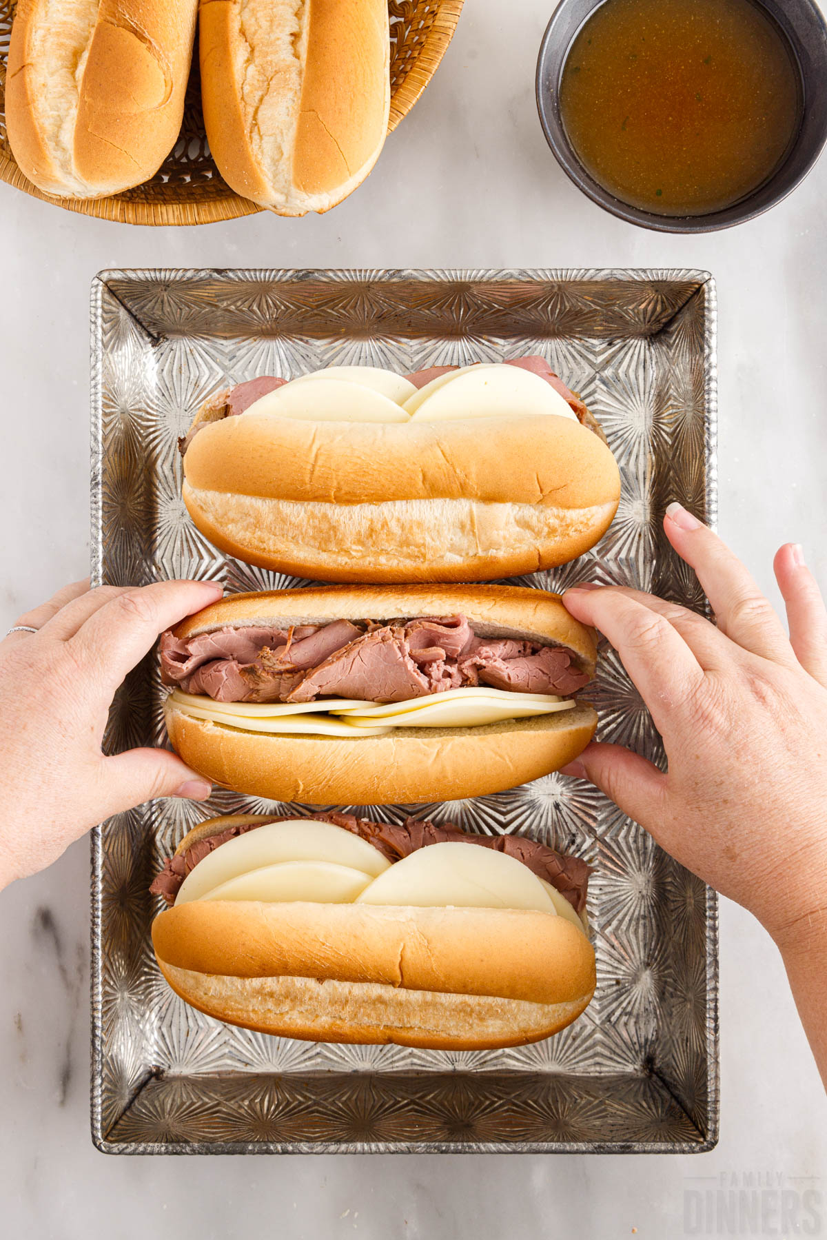 roast beef and cheese layered into hoagie rolls