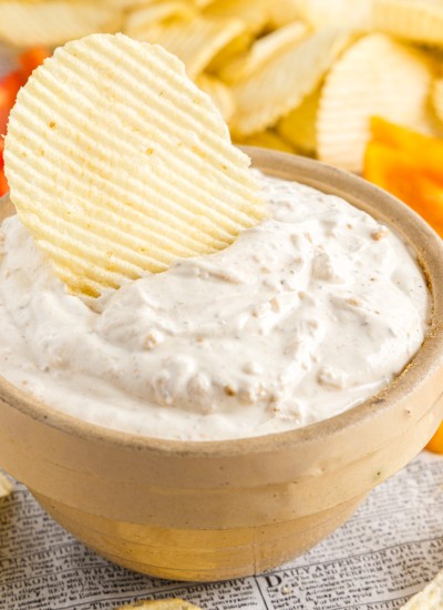 close up of a bowl of sour cream and onion dip