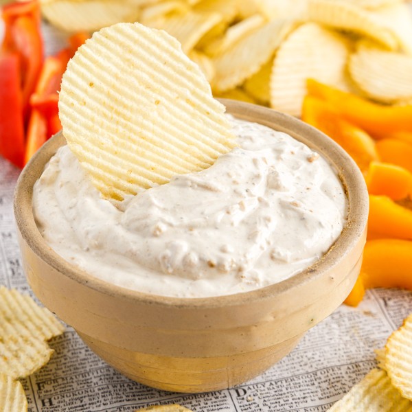 close up of a bowl of sour cream and onion dip