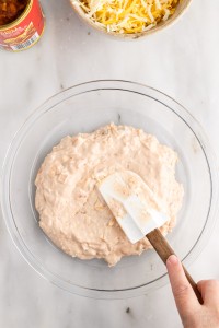 spreading cream cheese mixture into a pie plate