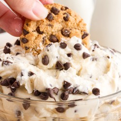Cookie dipped into cookie dough dip.