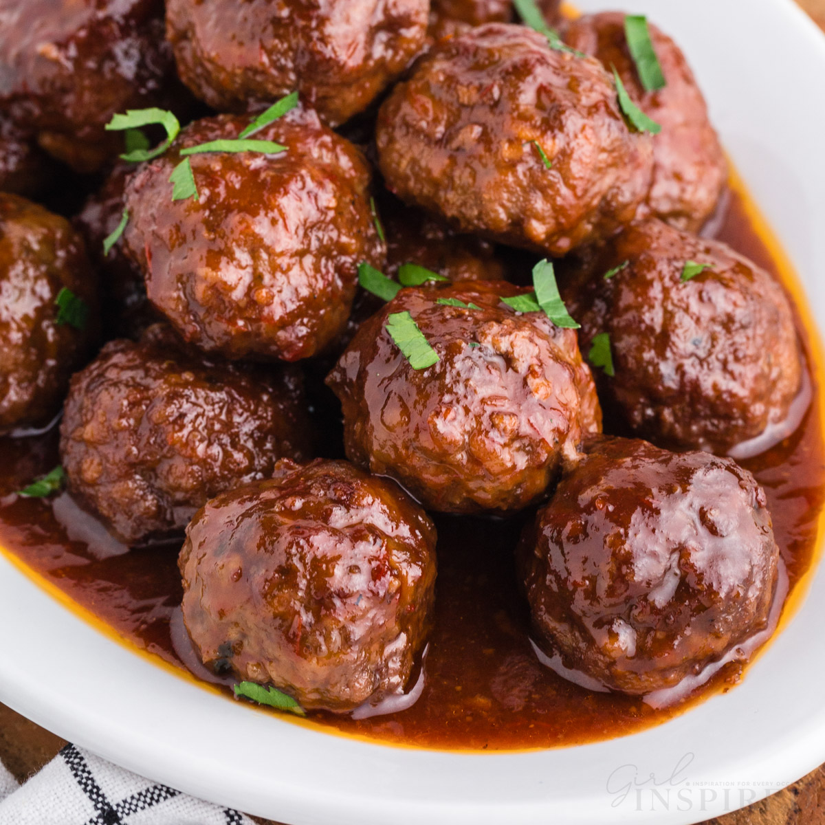 Crockpot Meatballs with jelly sauce on a platter

